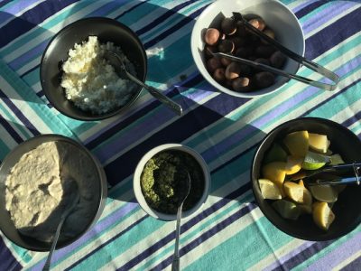 White bean hummus and sides for mediterranean buffet